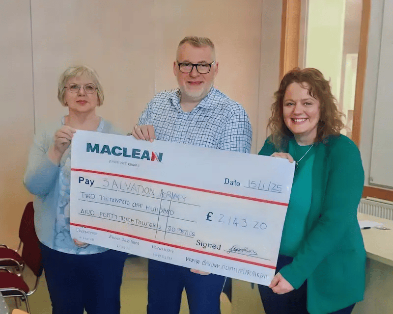 Gina Mooney, ESG Lead at MacLean International, presenting a cheque of £2,103.20 to Major Peter Renshaw of The Salvation Army, raised through a Christmas Jumper Day fundraiser.