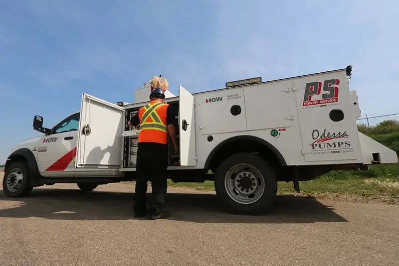 Image shows a service truck with Odessa Pumps and Power Service logos doing repairs, installation and preventative maintenance in the field