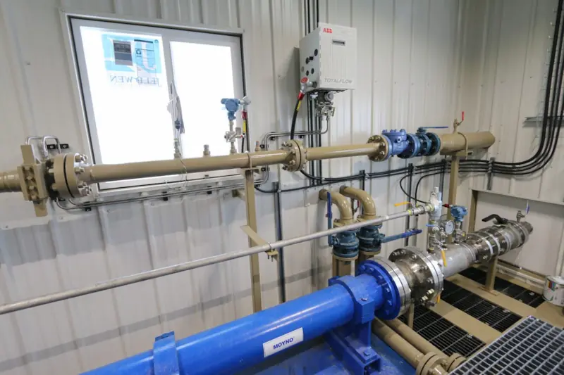 Photo of Power Service's oil, water & gas measurement skid with cold weather package, featuring a Moyno pump an ABB measurement & analytics device.