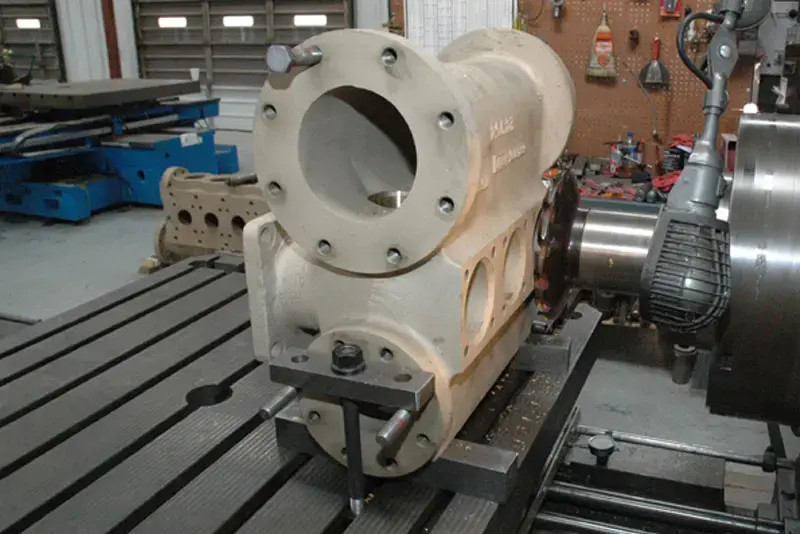 Image of piston pump fluid end repair done by DNOW specialized in-house pump repair, overhaul and machining services